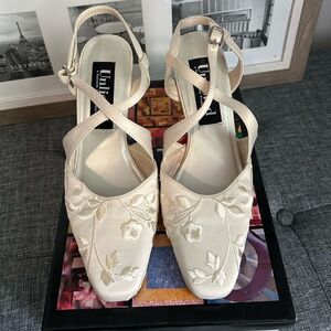 Unlisted cream colored dress shoes